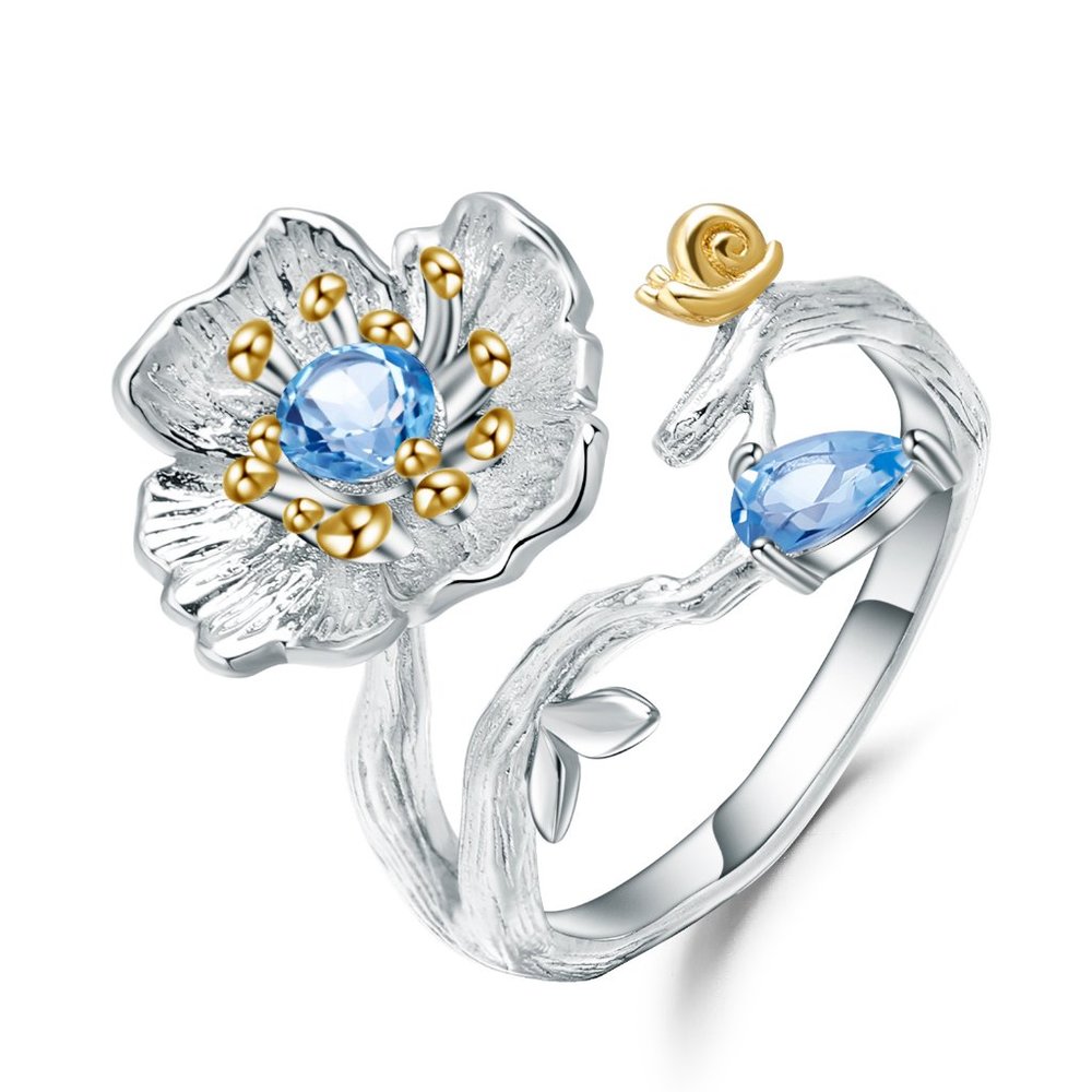 Flower Ring in Sterling Silver with a Blue Topaz.